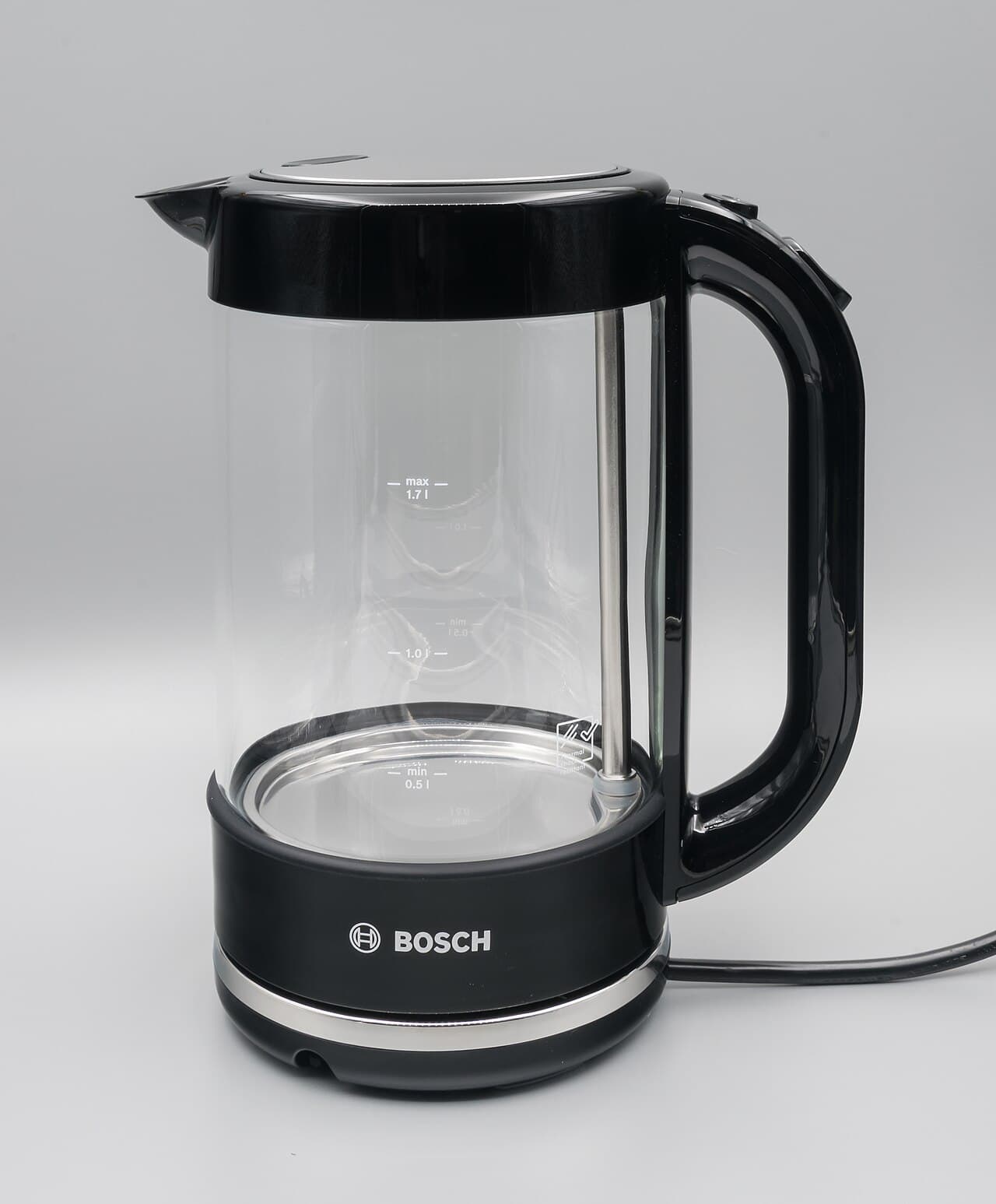 Stainless steel electric kettle on its base
